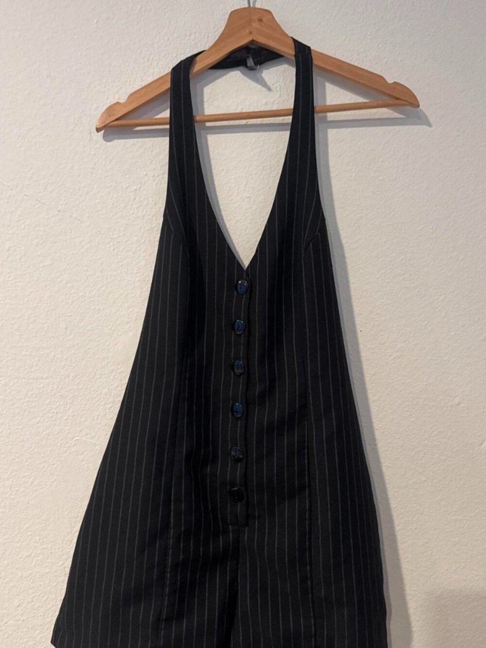 Black pinstripe playsuit with thin white vertical stripes, size M